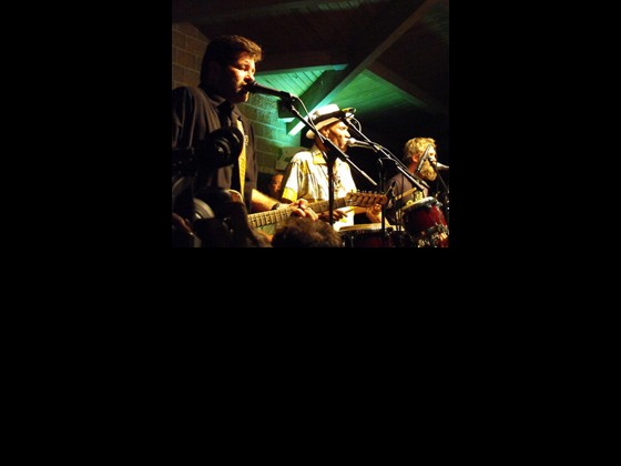 Members of Tab Benoit's Swampland Jam: Tab Benoit, Cyril Neville, and Anders Osborne