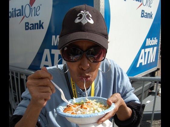 Artist Liaison Dee Lindsay samples some of the delicacies at FQF