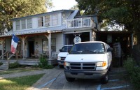 Tour buses in front of the Blue Moon Saloon and Guest House