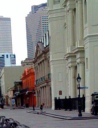 Kneeling man in front of church in Jackson Square